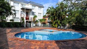 Outdoor pool, open 7:00 AM to 8:00 PM, pool loungers