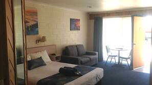 Minibar, desk, laptop workspace, iron/ironing board