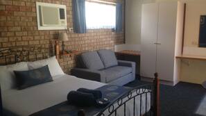 Minibar, desk, laptop workspace, iron/ironing board