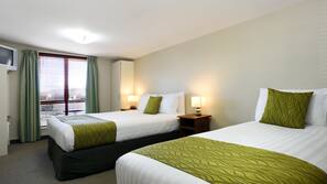 Premium bedding, blackout curtains, soundproofing, iron/ironing board