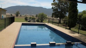 Seasonal outdoor pool, open 8:00 AM to 6:30 PM, pool loungers