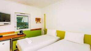 Premium bedding, laptop workspace, blackout curtains, cots/infant beds