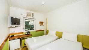 Premium bedding, laptop workspace, blackout curtains, cots/infant beds