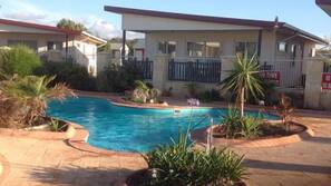 2 outdoor pools, open 7:30 AM to 7:00 PM, pool umbrellas, pool loungers