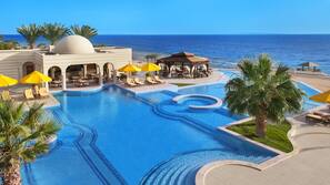 Outdoor pool, pool umbrellas, sun loungers