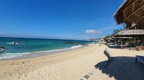 Private beach, white sand, sun loungers, beach umbrellas