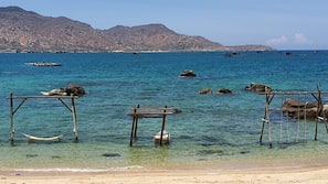 Private beach, white sand, sun loungers, beach umbrellas