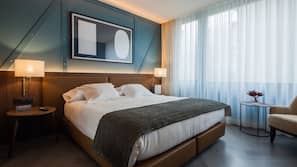 Ropa de cama de alta calidad, edredones de plumas, minibar y caja fuerte