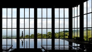 Indoor pool, outdoor pool, pool umbrellas, sun loungers
