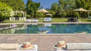 Outdoor pool, open 9:00 AM to 8:00 PM, pool umbrellas, pool loungers