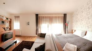 Luxe beddengoed, een minibar, een kluis op de kamer, een bureau