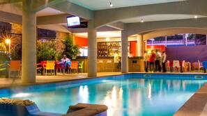 Indoor pool, outdoor pool, pool umbrellas, pool loungers