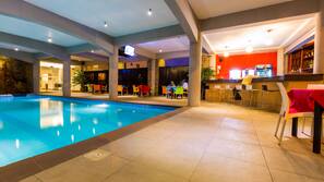 Indoor pool, outdoor pool, pool umbrellas, pool loungers