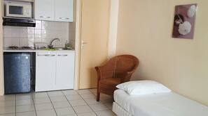 Fridge, microwave, coffee/tea maker, cookware/dishes/utensils