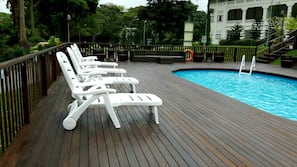 Outdoor pool, open 9 AM to 9 PM, pool umbrellas, pool loungers