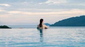 Outdoor pool, open 7:00 AM to 8 PM, pool umbrellas, sun loungers