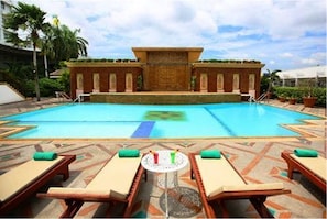 Outdoor pool, pool umbrellas, sun loungers