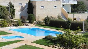 Seasonal outdoor pool, pool umbrellas, pool loungers