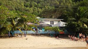 On the beach, sun-loungers, beach bar