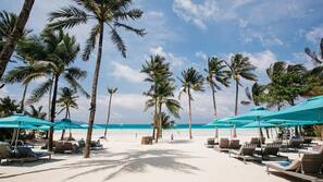 On the beach, white sand, beach towels