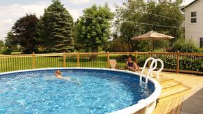 Outdoor pool, open 9:00 AM to 9:00 PM, pool loungers