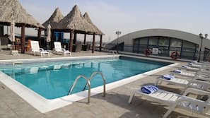 Outdoor pool, pool umbrellas, sun loungers