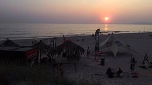 Beach nearby, white sand, surfing