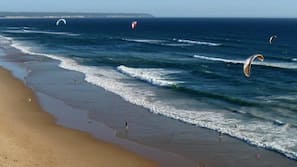 Beach nearby, white sand, surfing