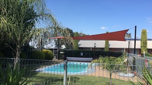 Outdoor pool, open 2:00 PM to 8:00 PM, pool loungers