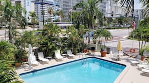 Outdoor pool, pool umbrellas, sun loungers