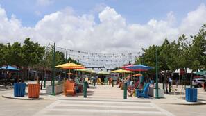 Beach nearby, white sand, beach towels