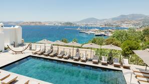Outdoor pool, pool umbrellas, sun loungers