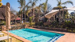 Seasonal outdoor pool, open 7:00 AM to 7:00 PM, pool umbrellas