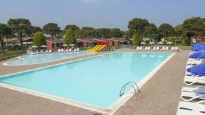 2 outdoor pools, pool umbrellas, pool loungers
