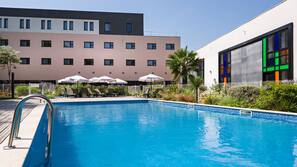Seasonal outdoor pool, pool umbrellas, pool loungers