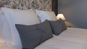 Premium bedding, blackout curtains, cots/infant beds, free WiFi