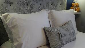 Premium bedding, blackout curtains, cots/infant beds, free WiFi
