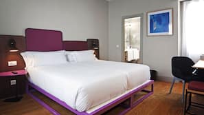 Luxe beddengoed, een minibar, een kluis op de kamer, een bureau