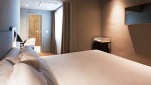 Luxe beddengoed, een minibar, een kluis op de kamer, een bureau