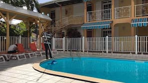 Outdoor pool, pool umbrellas, sun loungers