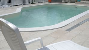 Outdoor pool, open 8:00 AM to 8:00 PM, sun loungers