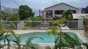 Outdoor pool, open 8:00 AM to 8:00 PM, sun loungers