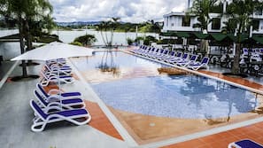 Outdoor pool, open 9:30 AM to 9:30 PM, pool loungers
