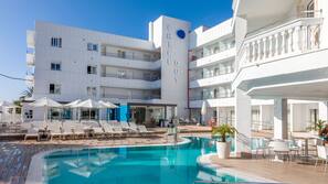 Seasonal outdoor pool, pool umbrellas, pool loungers