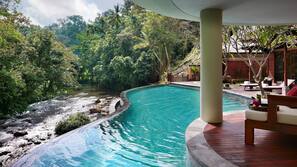 Outdoor pool, free cabanas, pool umbrellas
