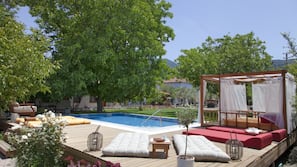 Outdoor pool, pool umbrellas, sun loungers
