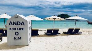 On the beach, sun-loungers, beach umbrellas, scuba diving