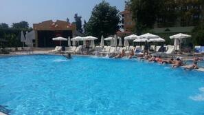 Outdoor pool, open 7 AM to 7 PM, pool umbrellas, sun loungers