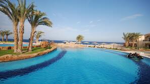 2 outdoor pools, pool umbrellas, pool loungers