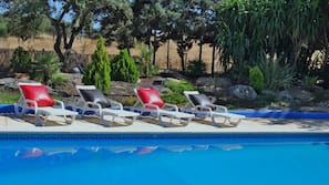 Seasonal outdoor pool, pool loungers